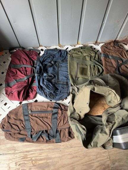 six canvas duffel bags