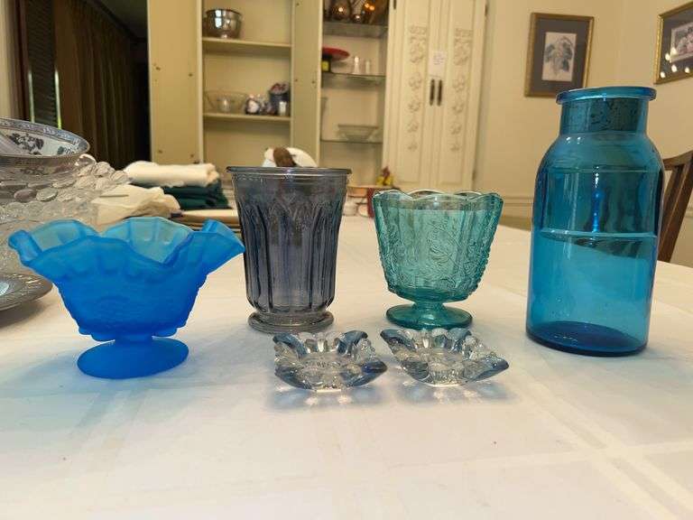 Grouping of nice glass ware…..from left - Westmoreland Satin Glass Candy dish, paneled base, paneled compote with grapevine design (color is peeling), cobalt blue apothecary jar with cork and (2) Westmoreland blue/clear ashtrays image