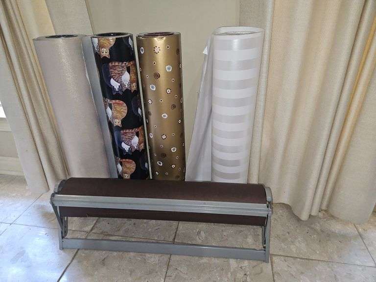 Wrapping paper stand & 5 rolls of 24" paper... image