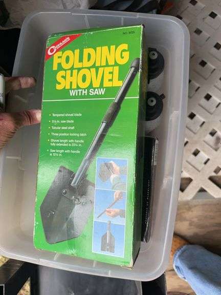 The two folding shovels with a saw in the handle