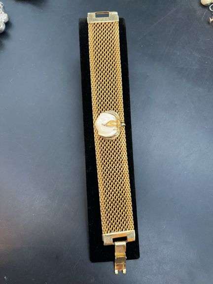 Elegant mesh gold tone bracelet with enamel/gold tone cotton boll image
