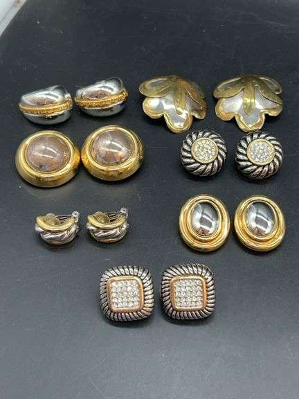 Grouping of gold and silver tone clip-on earrings…..some with rhinestones image