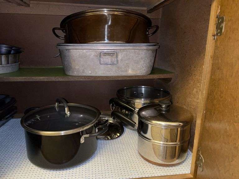 Contents of kitchen cabinet…..Revere Ware, Tools of the Trade stock pot, 2 roasters image