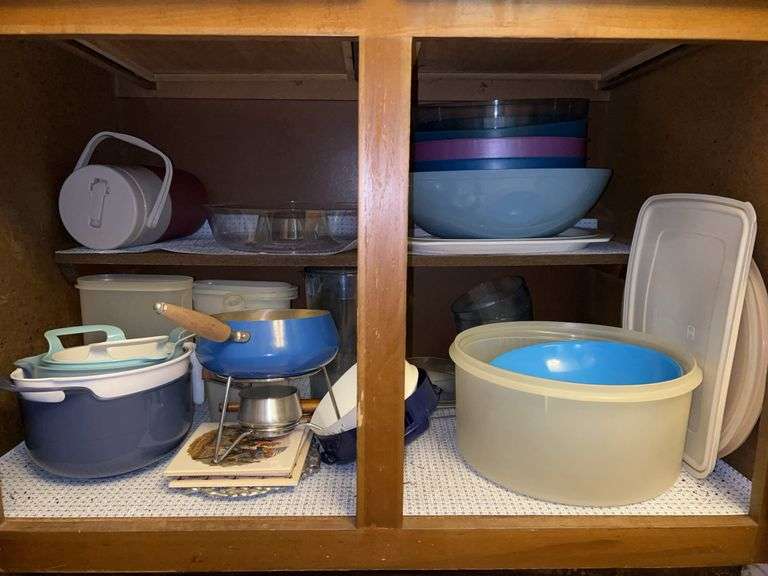 Contents of kitchen cabinet…..Tupperware, mixing bowls, fondue set and more image