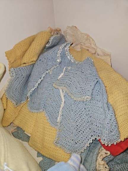 Contents of upstairs hall closet containing baby clothes, small child clothes and quilting material... image