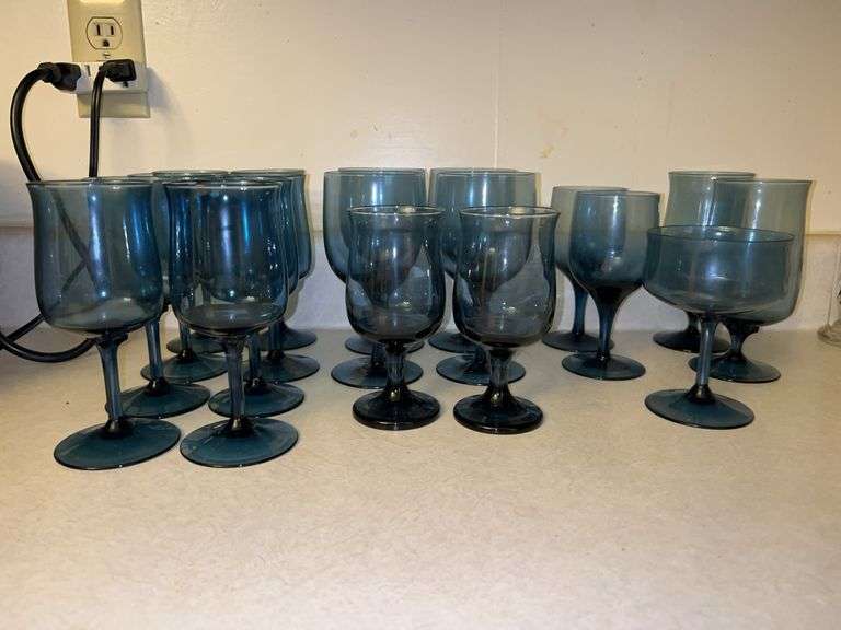 Grouping of various size and style cobalt blue stemware image