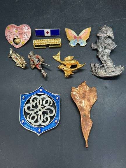 Grouping of enamel, copper clad and other various material brooches image