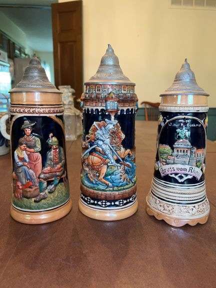(3) German steins…..Knight Dragon Slayer Beer Stein with lid (11-1/2” tall), Kaiser Wilhelm I Denkmal (Emperor Wilhelm I Memorial) at the Deutsches Eck (musical) and German Oktoberfest Beer Stein image