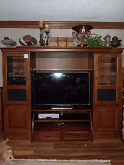 Hooker Entertainment Center 23X76.5X21. Each side shelf is 23" wide.      Center shelf and top piece removable...Contents inside and on top not1 included. TV Stand and TV in Center not included.