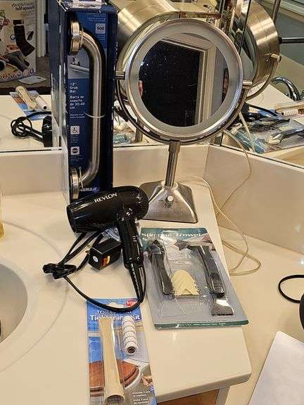 Items for the bathroom. Two-sided lighted makeup mirror, Revlon blow dryer, toilet seat tightening kit, 12-in grab bar, and silicone trowel scraper.