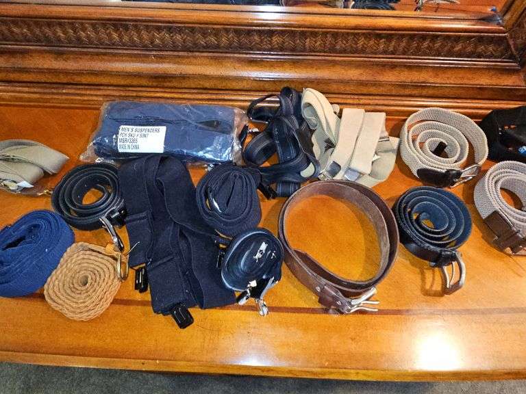 Grouping of men's belts and suspenders.