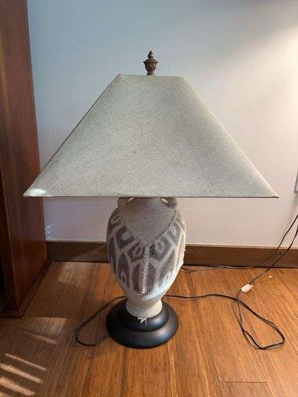 Uniquely designed urn-style lamp with woven base and cloth covered flared shade…..29” tall image