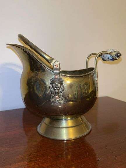 Miniature brass ash bucket with porcelain handle and lion’s head accents…..8” tall image