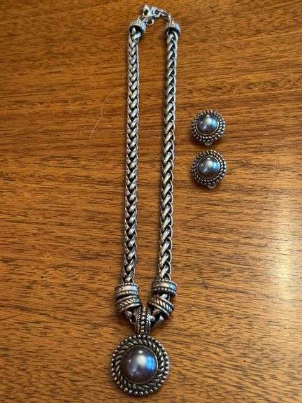 Silver tone braided chain necklace with gray bead pendant and matching clip-on earrings image