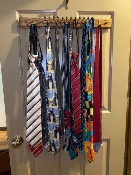 Nice grouping of ties…..UMO Lorenzo, Fine Art Picasso Collection, Norman Rockwell and more…..also includes wood tie rack image