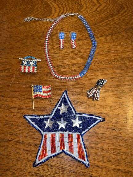 Grouping of both vintage and modern patriotic jewelry…..ribbon pendant of right honors the heroes from 9-11 and huge star is a pin image