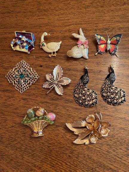 Elegant grouping of gold tone brooches image