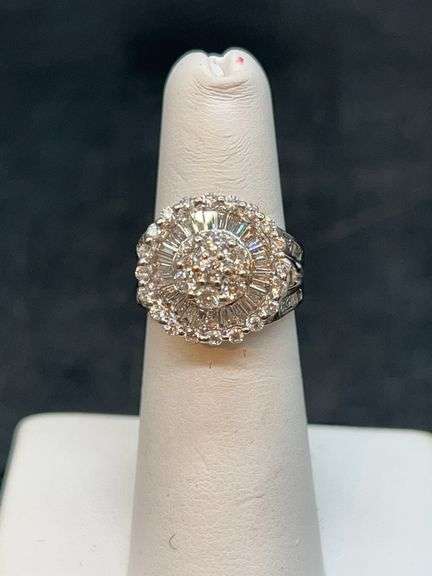 14K white gold diamond ring…..diamonds have been verified as authentic; however, no paperwork or authenticity as to lab or mined stones….total carat weight is unknown but setting has a 5/8” diameter…..9 grams….size 5 image