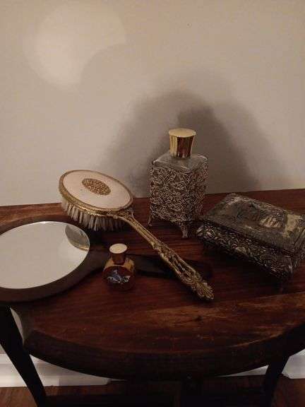 Group of dresser trinkets. The box does have some damage as shown.