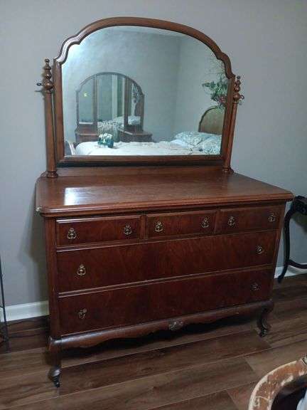 Antique 5 drawer dresser with tilt mirror. Open and closes well..52x24x72