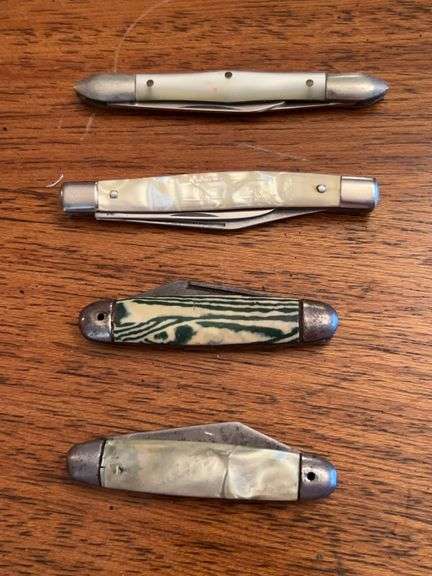 Grouping of 4 small and skinny pocket knives image