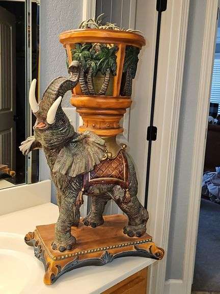 Resin elephant plant holder. 13.5 x 8 x 24 in tall.