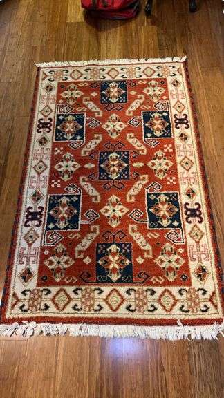 36-1/2 x 60 area rug in hues of cream, red, blue image