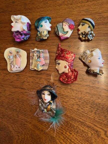Elegant grouping of lady head brooches image