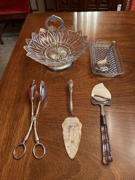 Grouping of clear glass, crystal, silverplate and stainless serving bowls and utensils….salad set is by IS, cake server is monogrammed, cheese plane is by Mirage and Cranberry set is Sheffield image