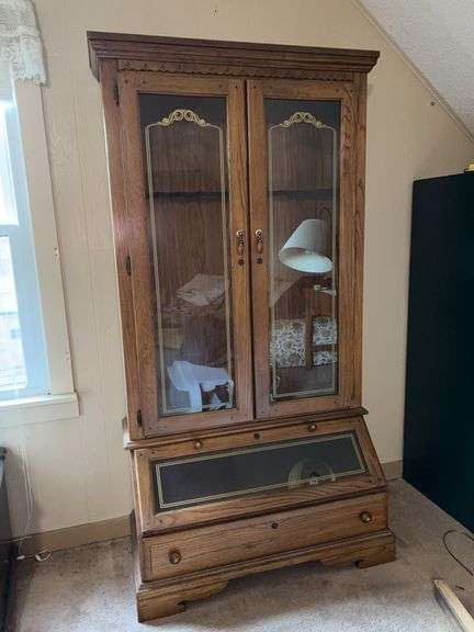 Nice looking Harrison Ward oak gun cabinet…..holds 10 guns…..39-1/2 x 19 x 76 tall….no key image
