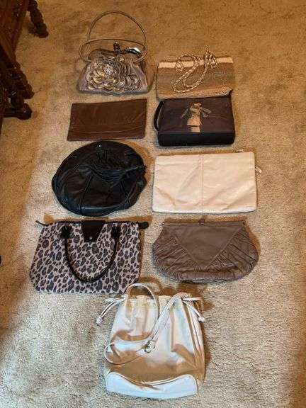 Grouping of ladies handbags in various sizes and designs image