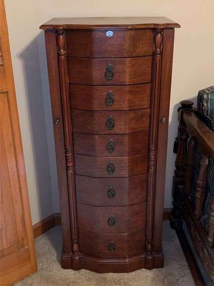 Extraordinary cherry finish jewelry chest with 2 side doors, top area with mirror and 8 drawers….18 x 12 x 40-1/2 tall image