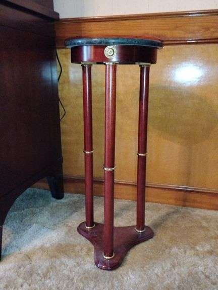 Beautiful mahogany plant stand with green marble top and gold accents... 12"D x 27" tall image