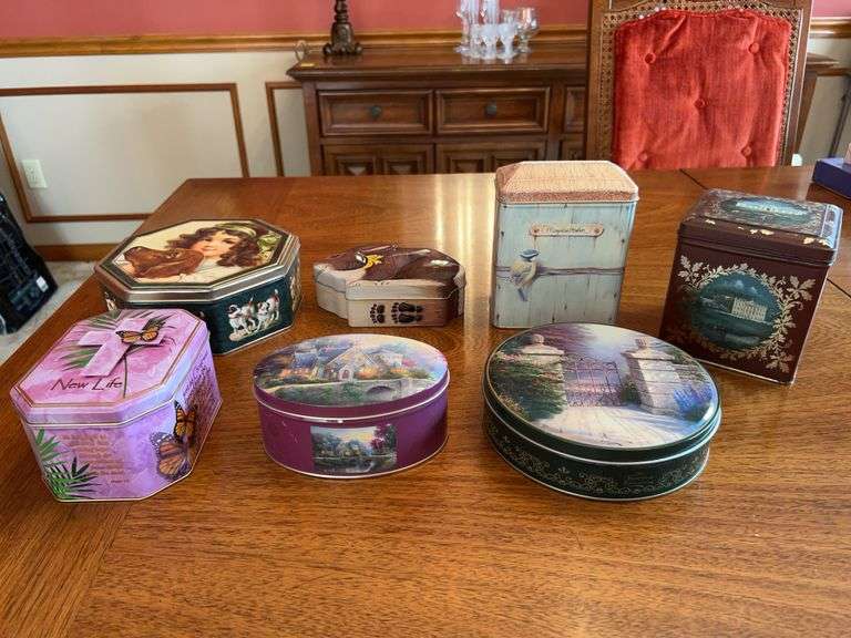 Nice selection of various design and size tins…..oval Kinkade is a candle image