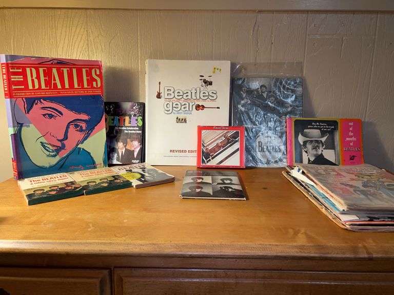 Large collection of Beatles memorabilia…..cover art on book far left is by Andy Warhol image