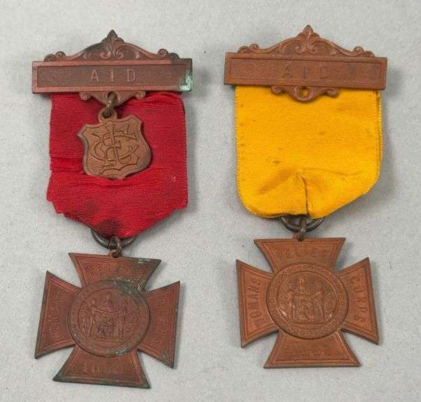 Two 1883 Woman's Relief Corps Staff Aid Badges image