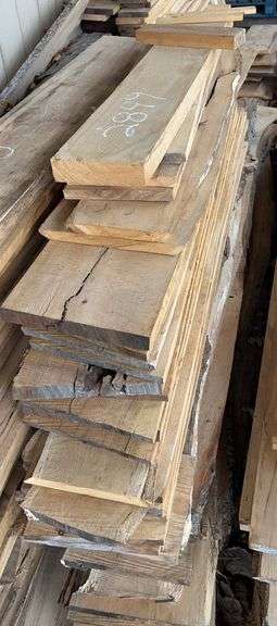 Stack of Rough Cut Lumber. Live edge not included image