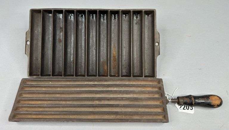 Unmarked Cast Iron Candle Mold & Griswold 11-Slot Cast Iron Cornbread Pan image