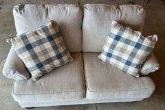 Upholstered Tan Loveseat