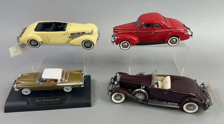 Four Die Cast Cars Studebaker Ford Cord Duesenberg image