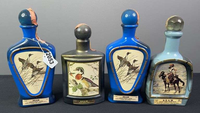 (4) Collecter’s Edition Jim Beam Whiskey Bottles image