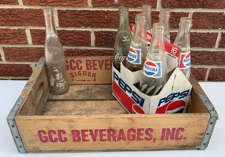 Pepsi and Coke Bottles with GCC BEVERAGES INC. Crate image