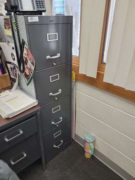 Four drawer file cabinet items in and around cabinet.Not included image