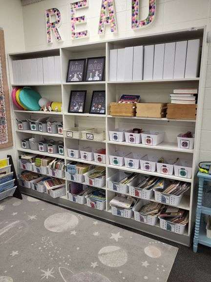 Large white bookshelf contents on and around not included. image