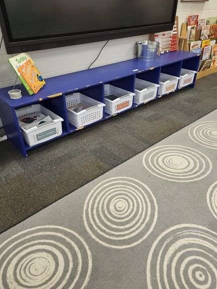 Lg blue storage bench- contents on and around bench not included image