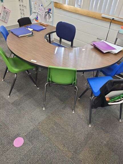Brown horseshoe school desk, 6 school stacking chairs, 1 adult chair- items on and around table not included image