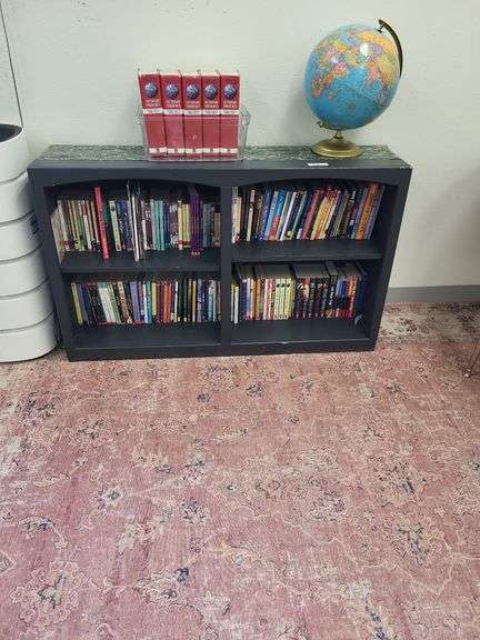 Black bookshelf- contents on and around bookshelf not included image