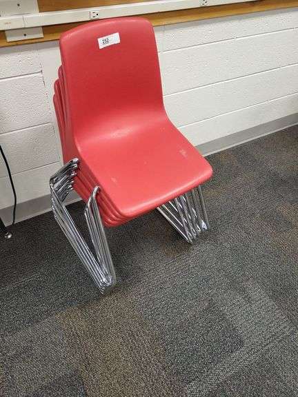 5 red stacking school chairs image