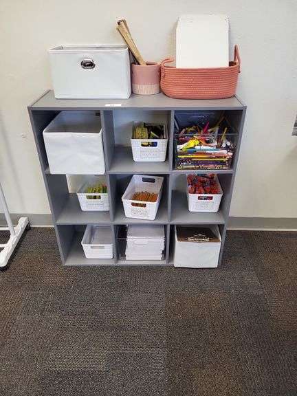 Grey storage shelf- items on shelf not included image