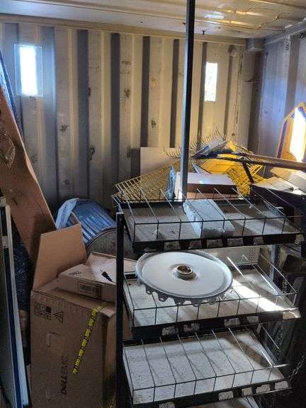 Misc racking pieces, trash can, rakes, fluorescent bulbs image